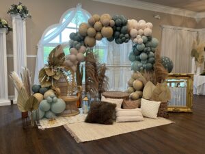 Beige, blue, and white balloon arch for baby shower